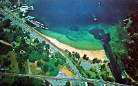 Aerial view of Weirs Beach and Lakeside Ave in the 1960s